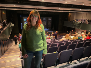 Elanor Higgins stood in the auditorium of Theatre Hafren