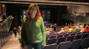 Elanor Higgins stood in the auditorium of Theatre Hafren