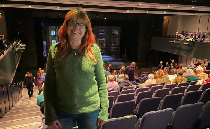 Elanor Higgins stood in the auditorium of Theatre Hafren