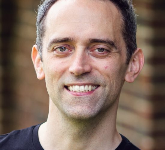 Bass Trevor Eliot Bowes is a young white man with short black hair,
